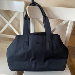 Brand new Lululemon black totebag. Excellent condition. Numerous pockets